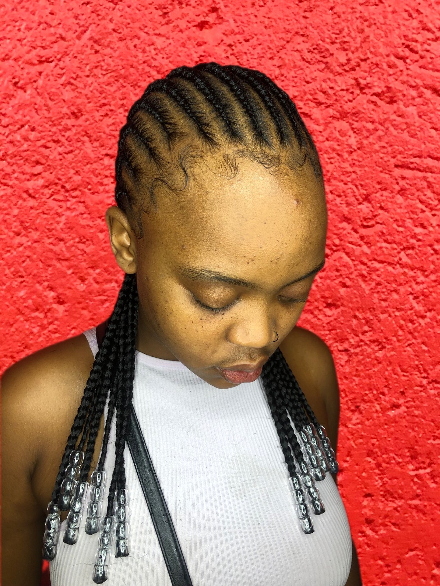 Sleek cornrows with beads